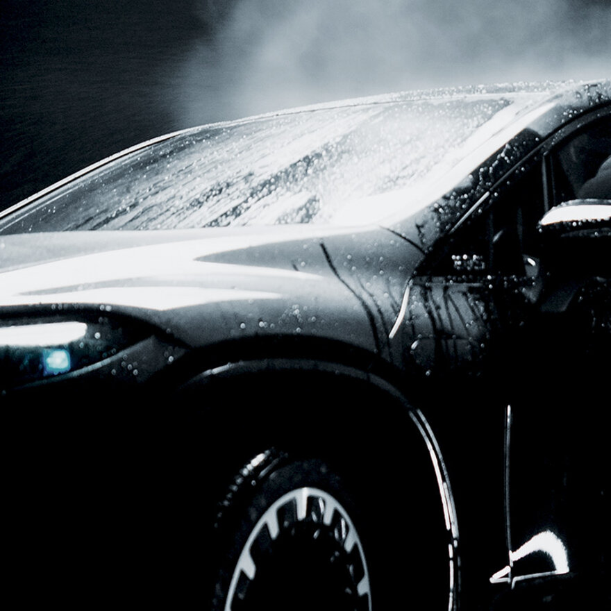 A car getting coated with shine polishes from the Car Wash Alliance during a car wash