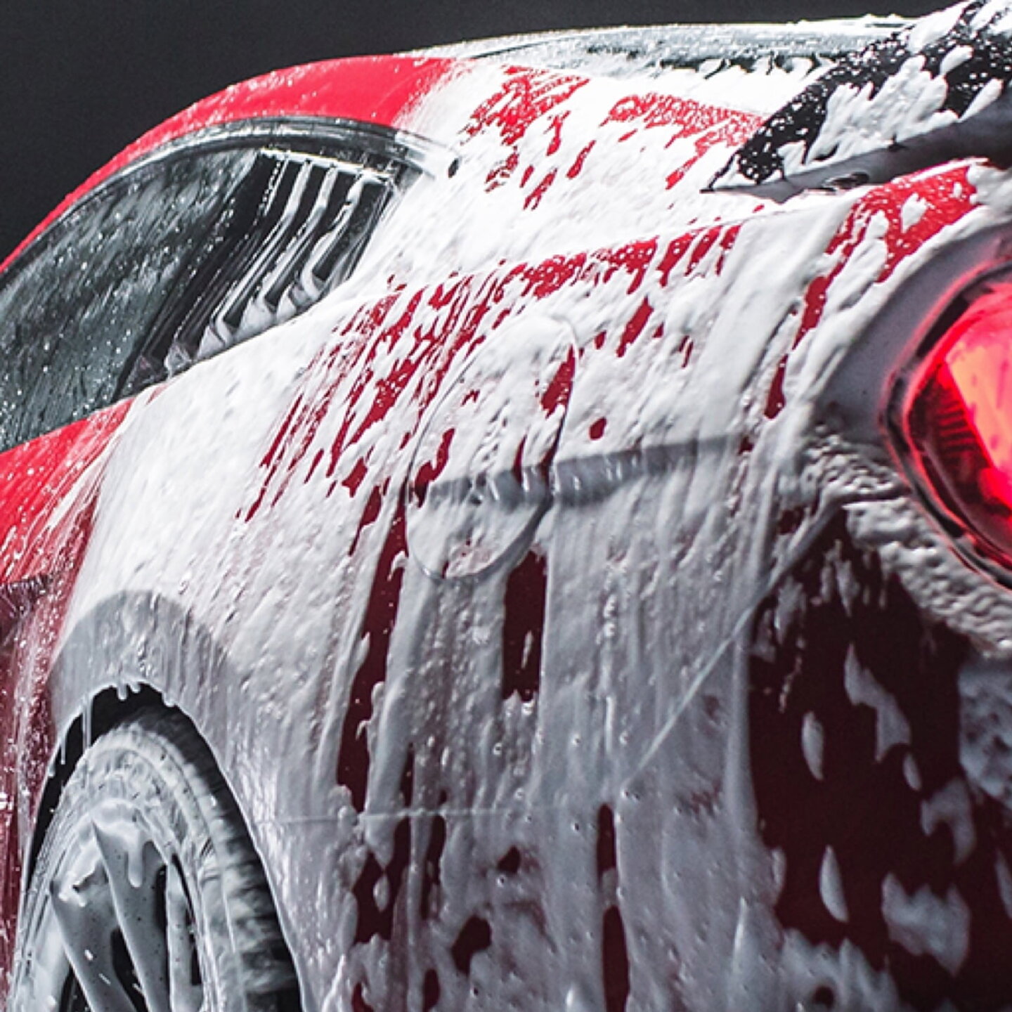 Conditioner being applied to a car, enhancing the paint's shine and depth