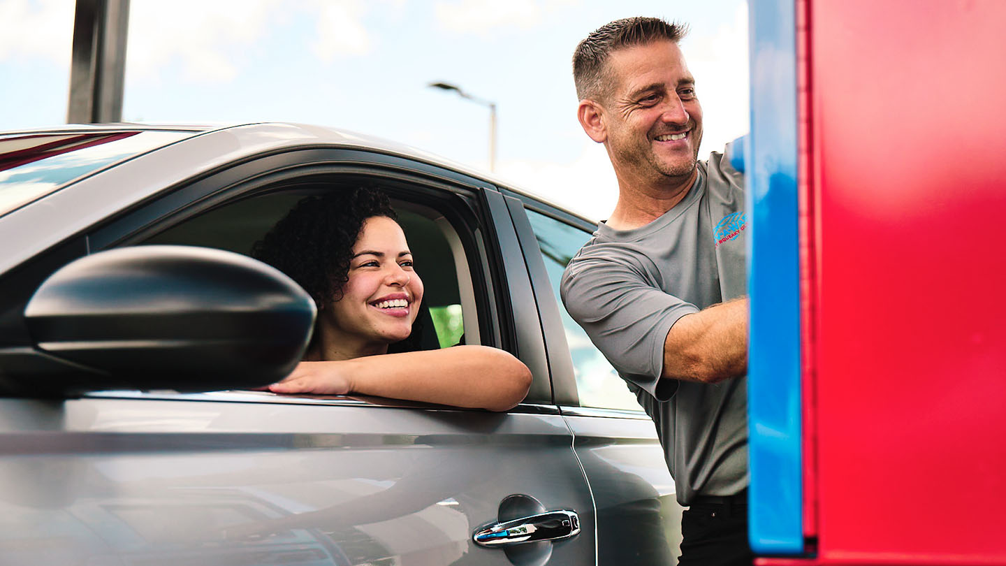 A car wash owner and his customer